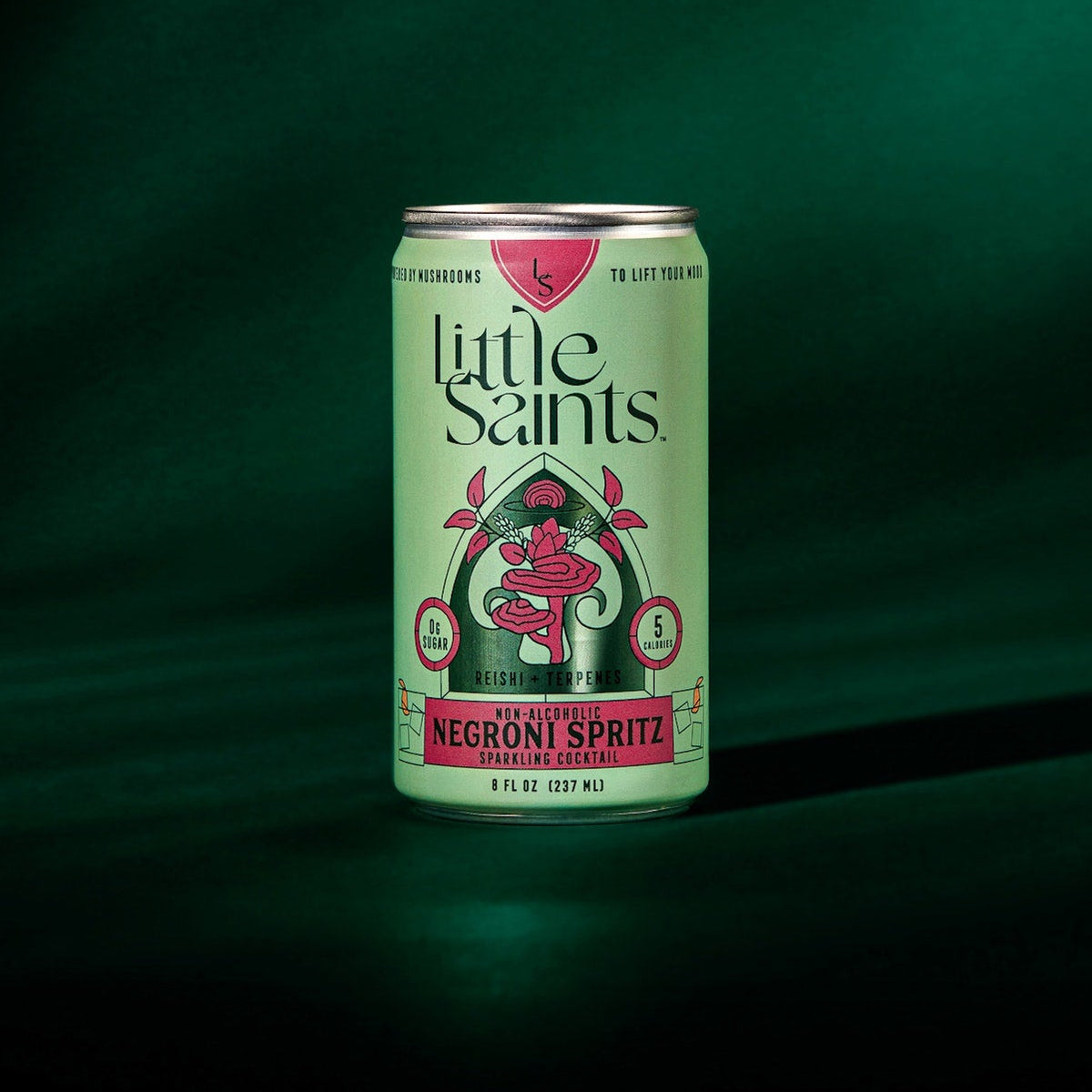 Can of 'Little Saints' Negroni Spritz on a dark green background